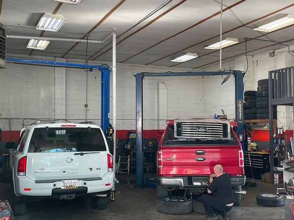 Cars On Lift Inside Auto Repair Shop — Hagerstown, MD — Guaranteed Truck & Auto Repair