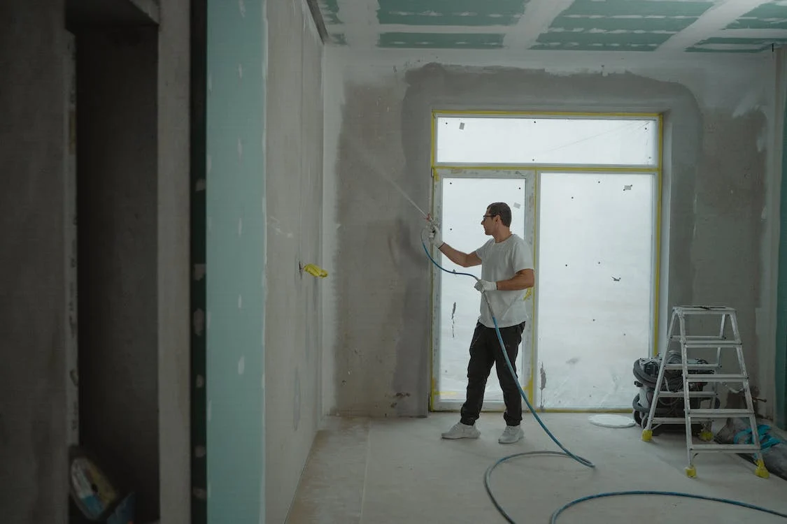 man spray painting long island