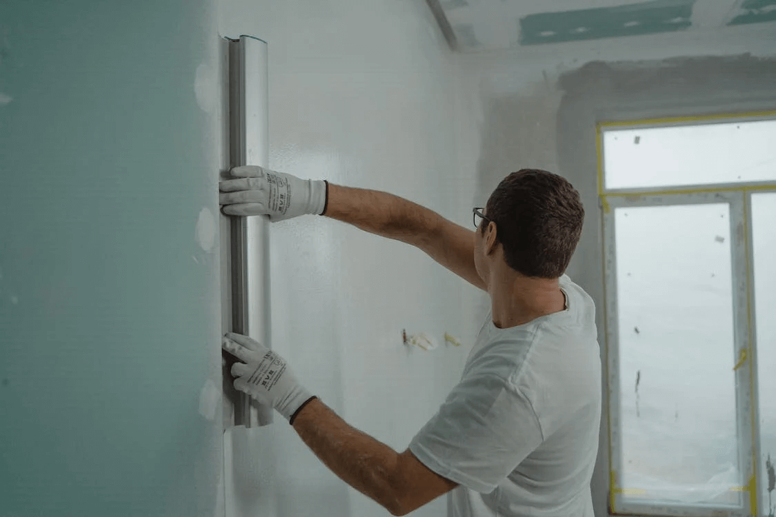 man painting wall long island