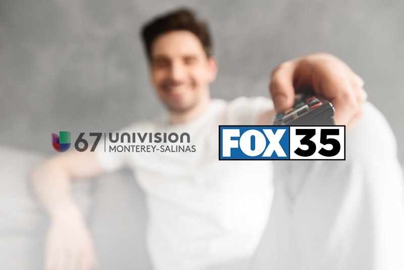 A man is holding a fox 35 remote control