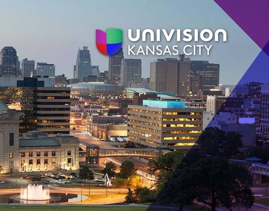 A poster for univision kansas city shows a city skyline