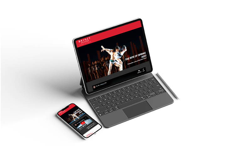 A laptop and a cell phone are sitting next to each other on a table.