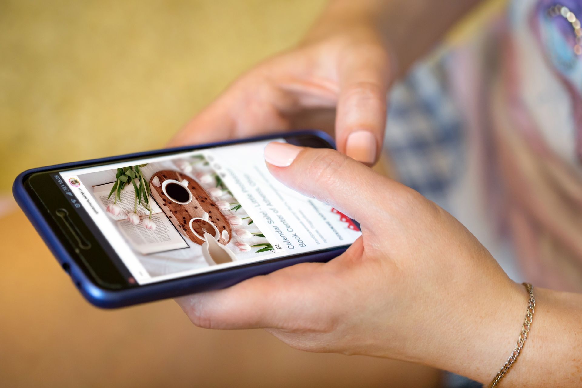 Hands holding a mobile phone