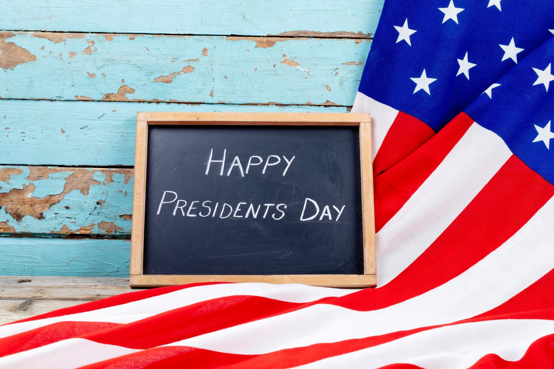 happy presidents day text on writing slate