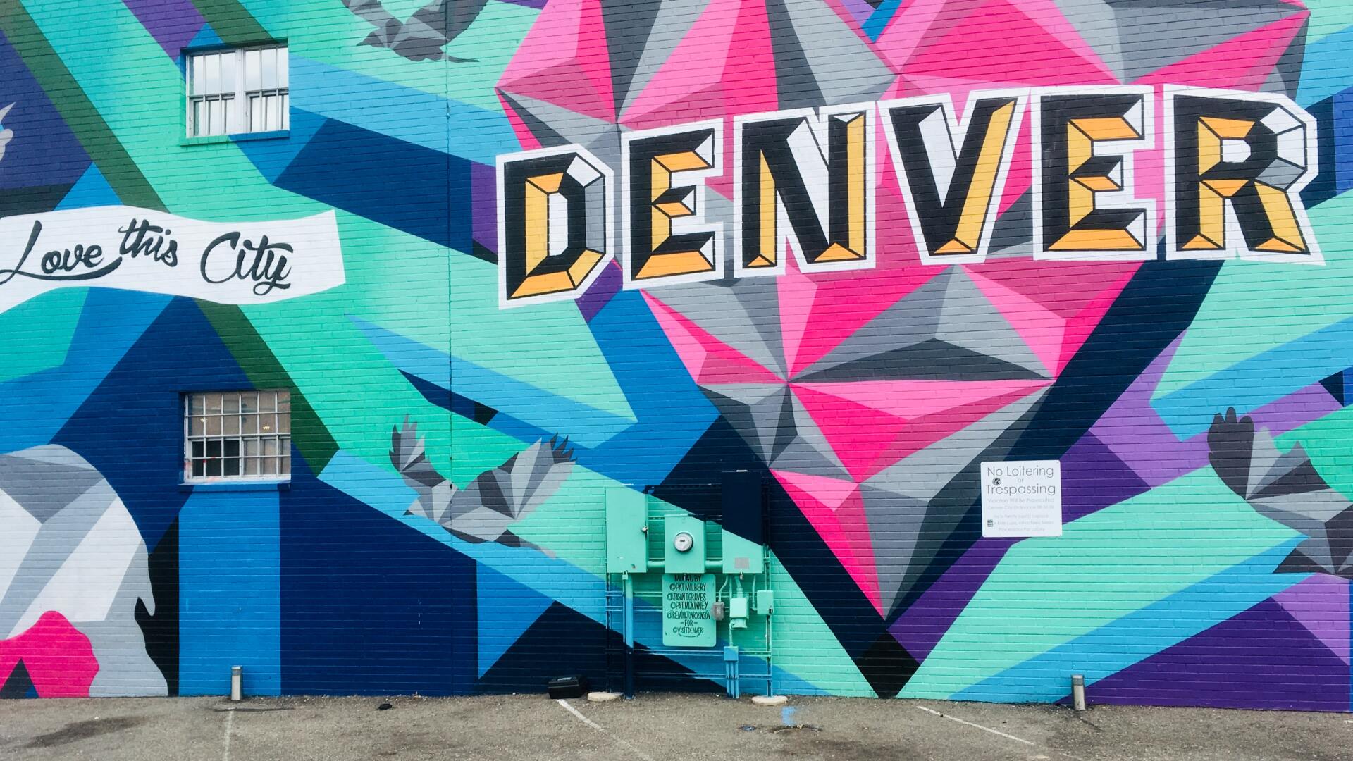 A colorful mural reads,