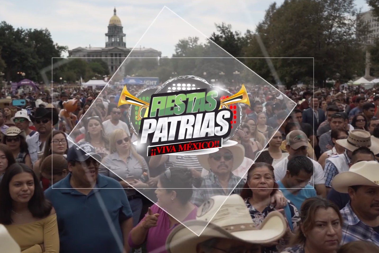 A large crowd of people are gathered in front of a sign that says fiesta patrias