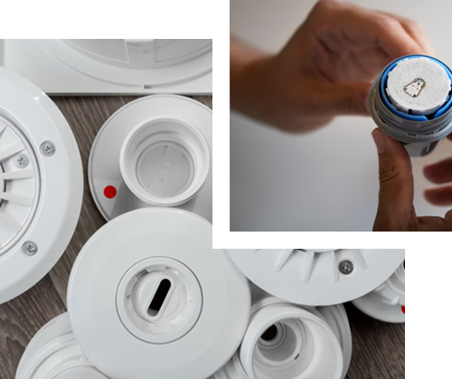 A man is fixing a faucet in a bathroom sink.