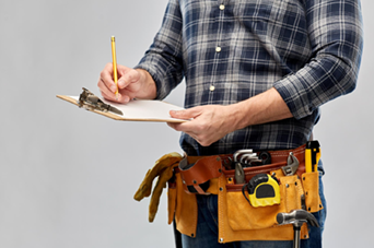 Black kitchen faucet with flexible spring and pull-down sprayer, white countertop.