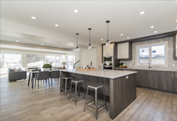 Man using a bow saw to cut wood in a workshop with tools and wood shavings.
