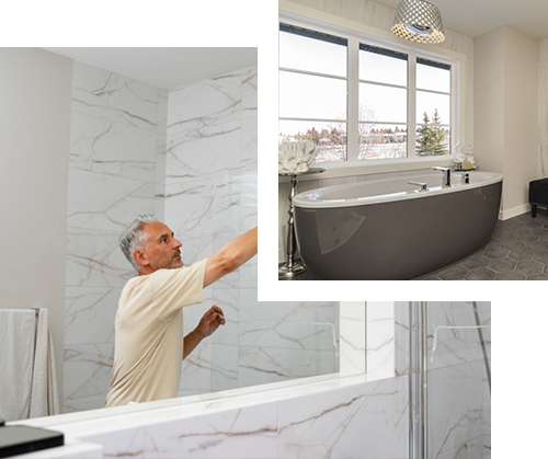 Man installing tile in a marble-tiled bathroom; a modern bathtub sits near a large window.