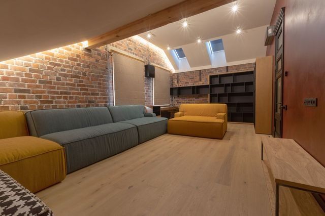 Black kitchen faucet with flexible spring and pull-down sprayer, white countertop.