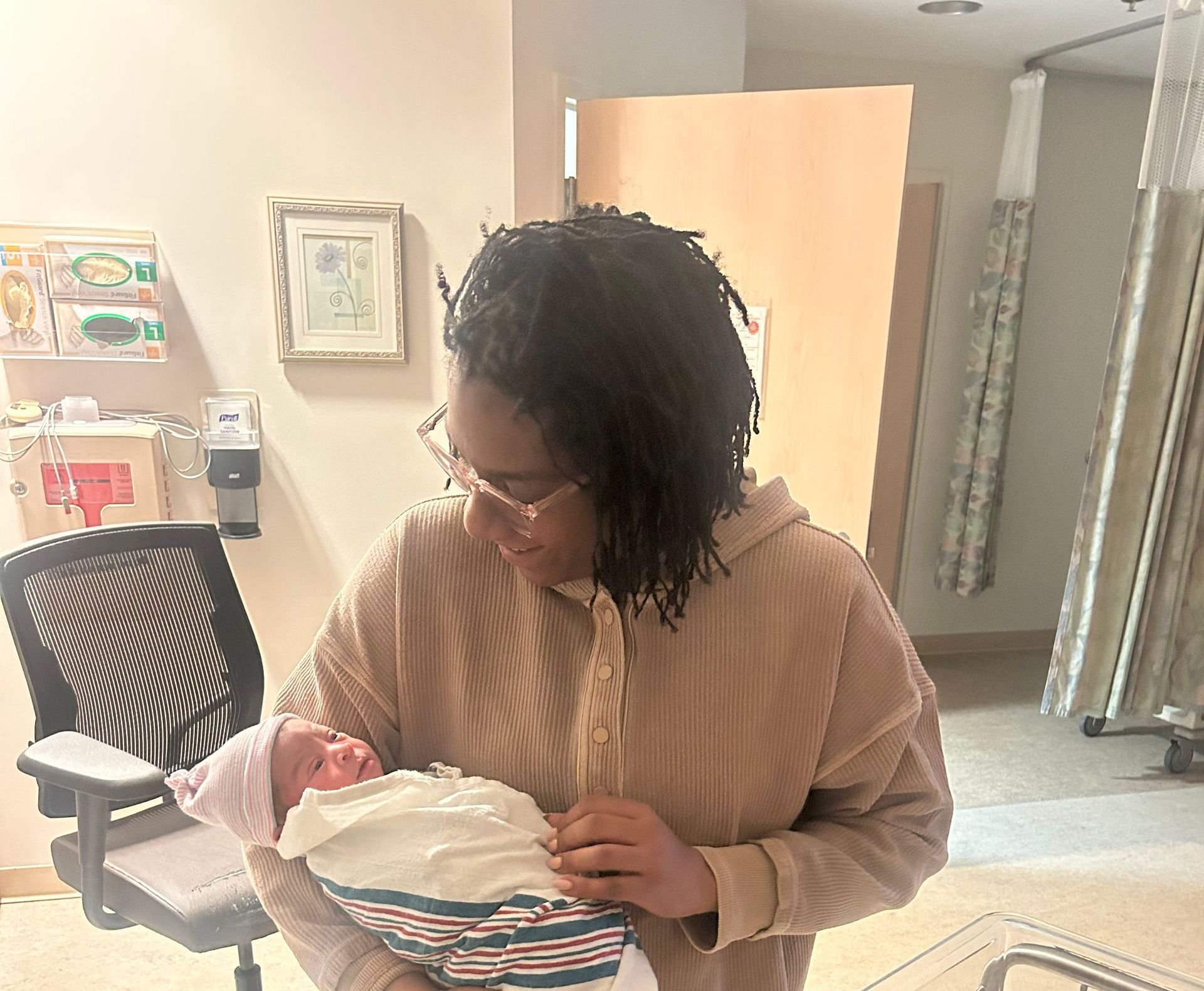 Shekita Long holding her fist doula baby with parents permission and photo release.