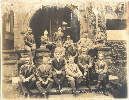 Historic 1922 staff portrait outside Dunbar Hospital in Detroit featuring Black physicians