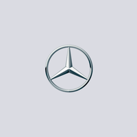 Mercedes-Benz logo: a silver three-pointed star inside a silver circle.