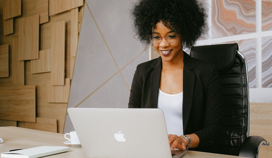 image of woman looking at laptop