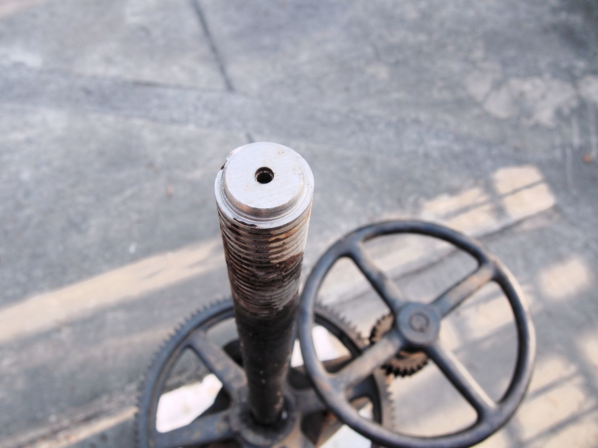 A close up of a metal object with a hole in the middle