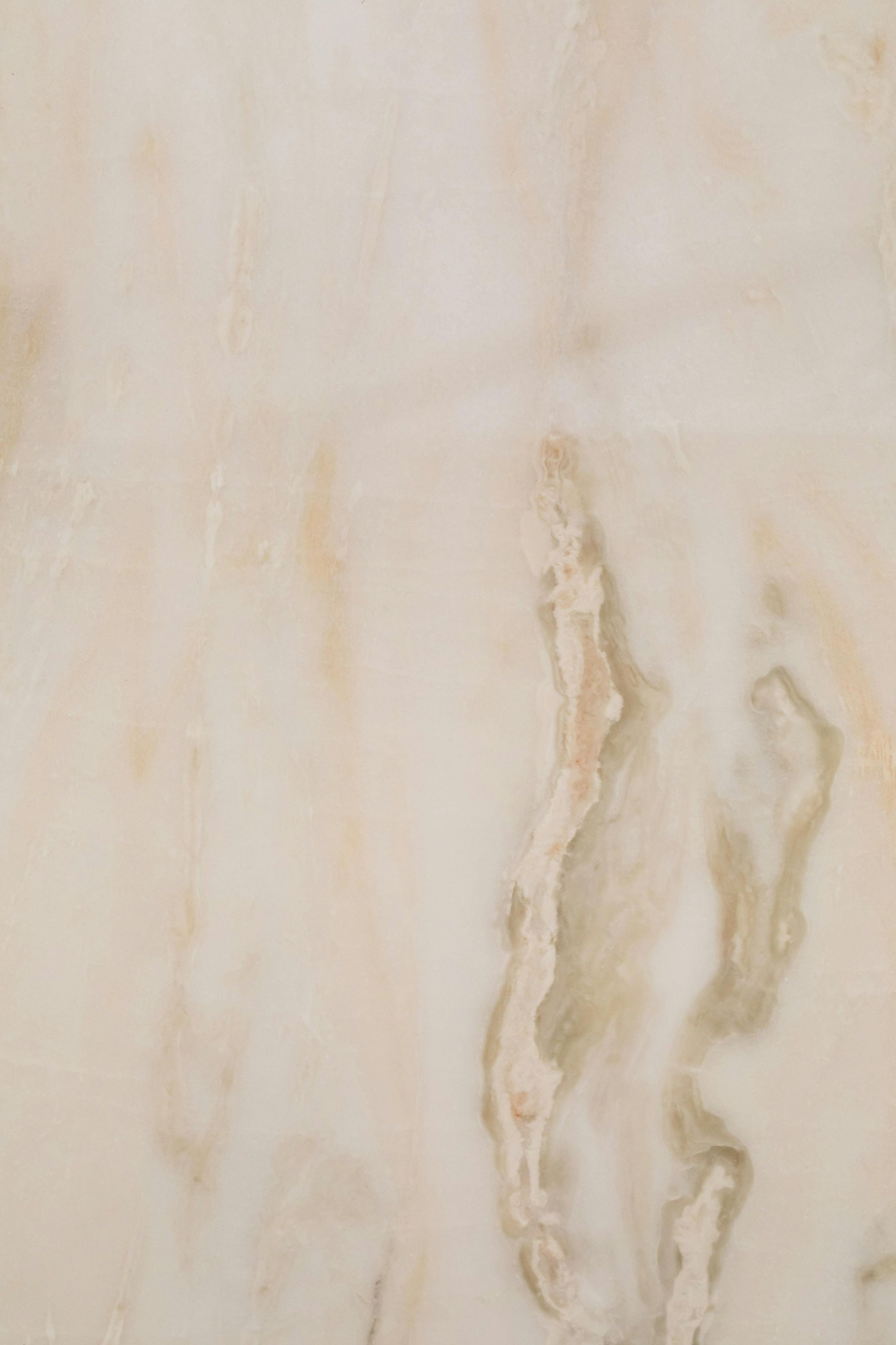 A close up of a marble tile with a marble texture.