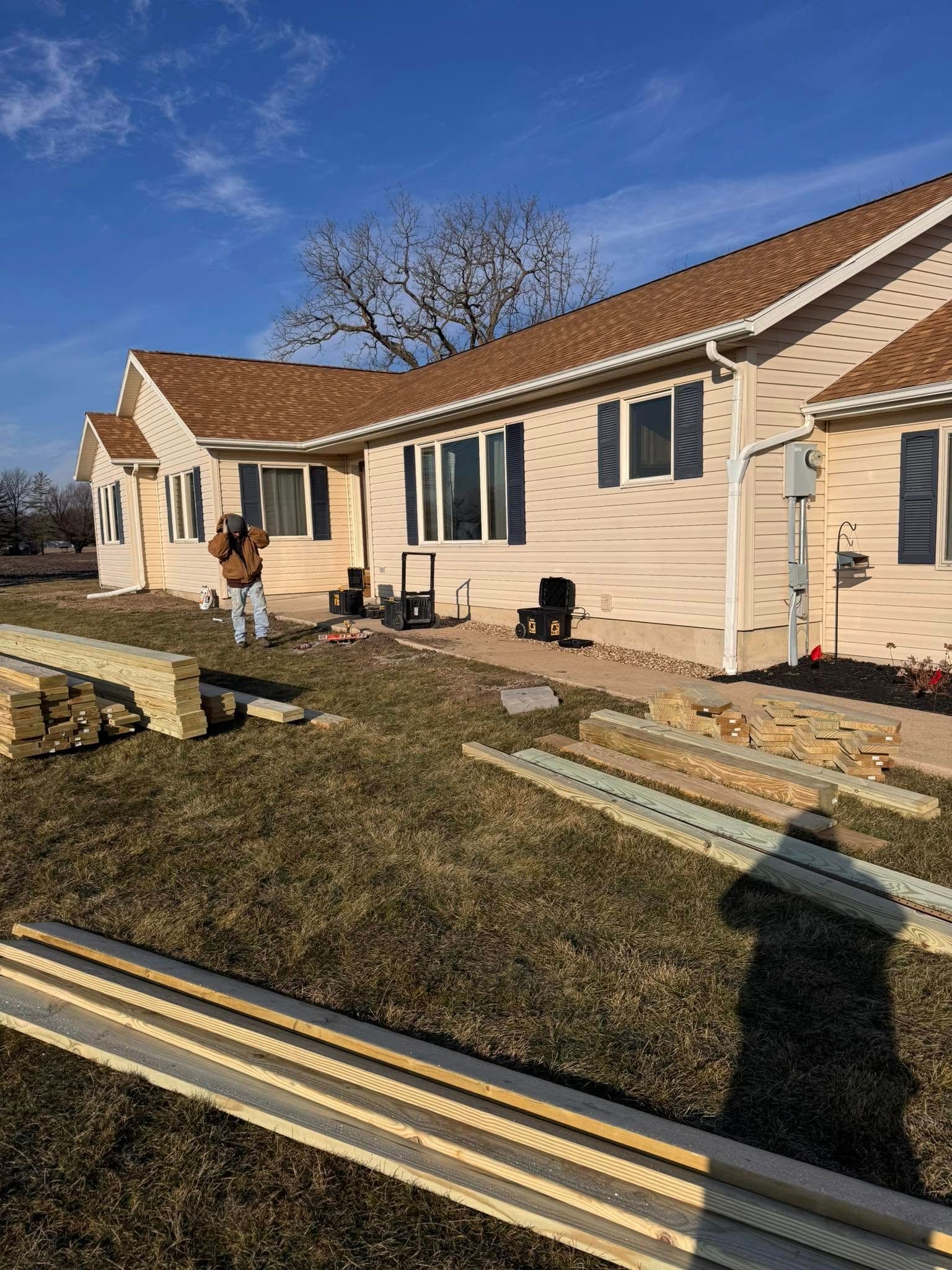 An empty room with a wooden floor and white walls.