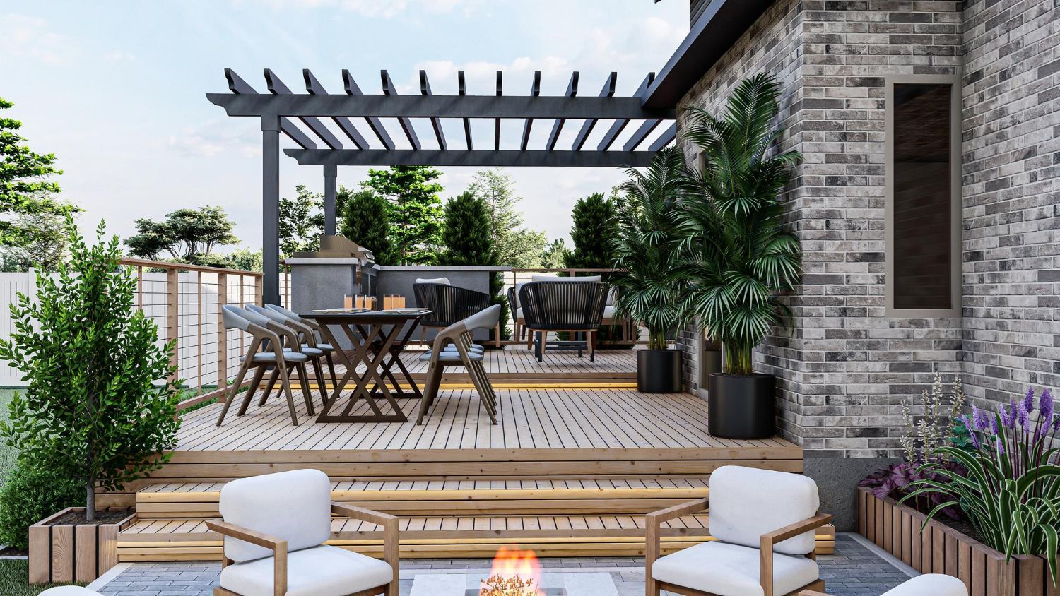 Modern patio with gray stone house, pergola, dining table, and woven lounge chairs surrounded by greenery.