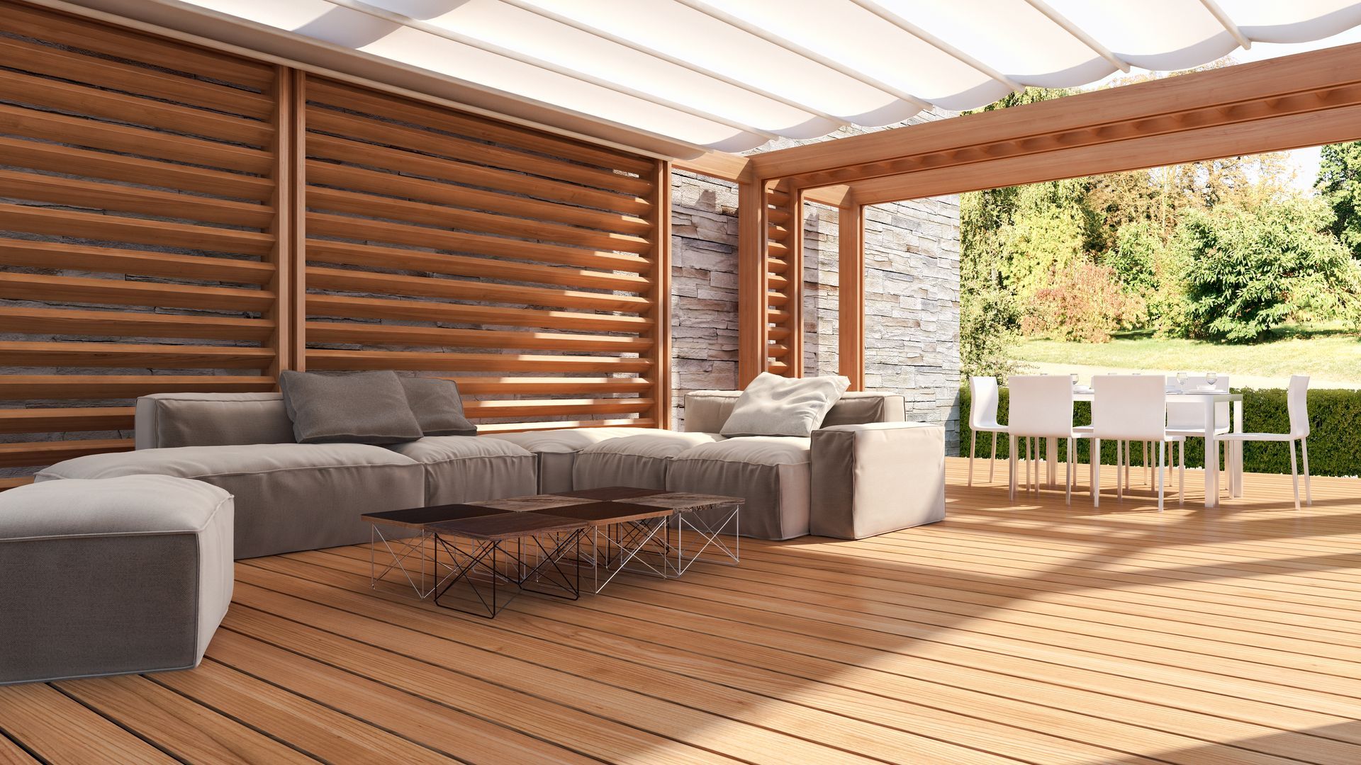 A living room with a couch , table and chairs under a pergola.
