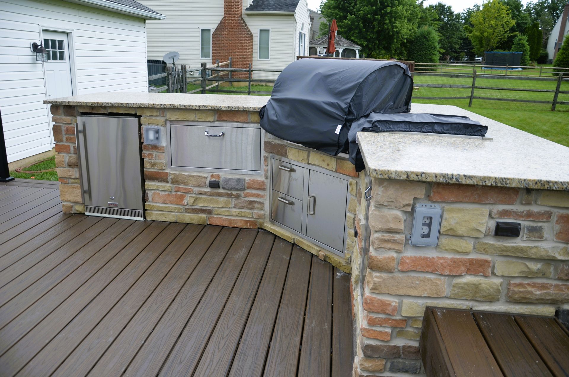 A grill on a deck with the number 3 on it