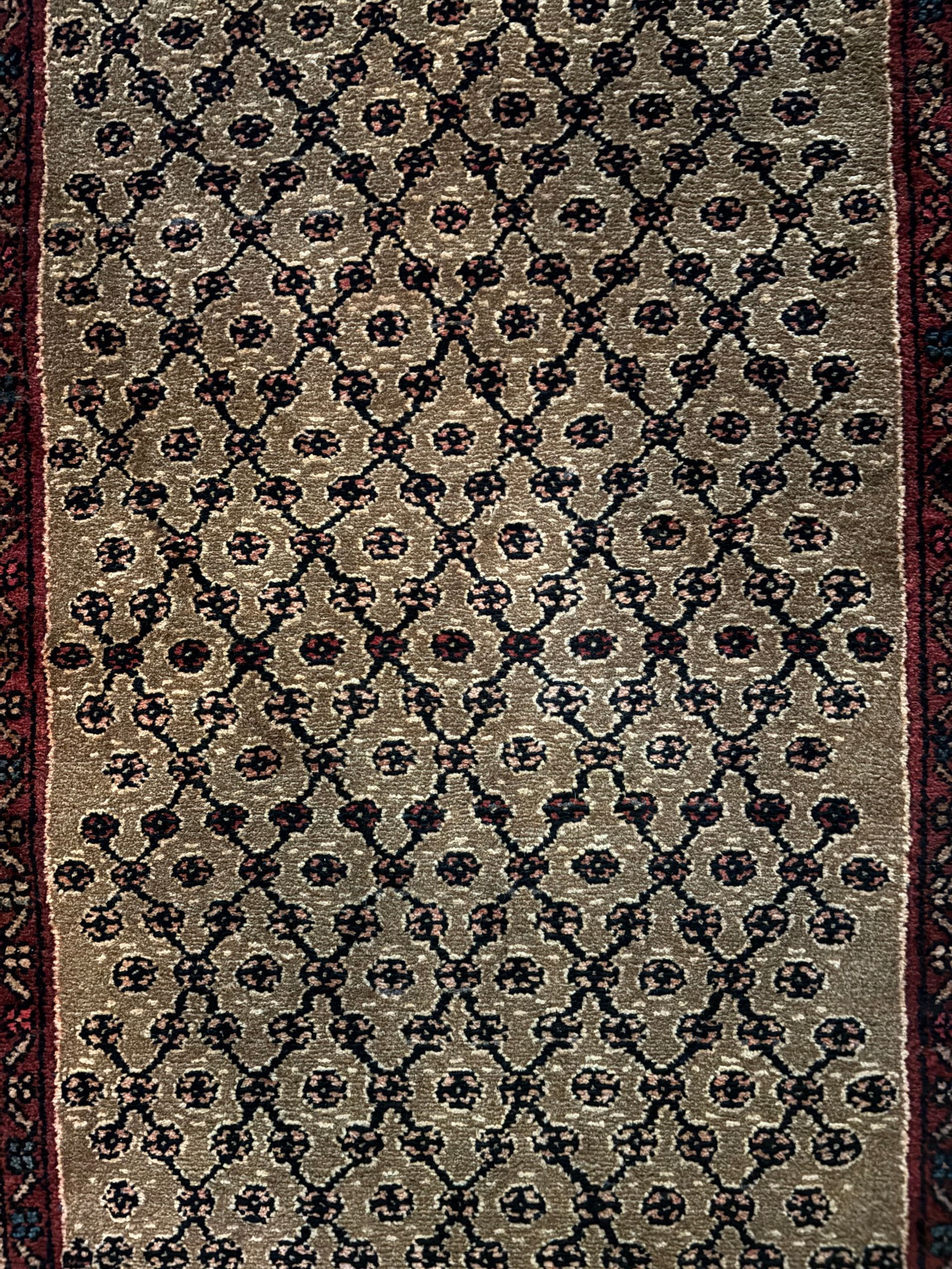 A close up of a rug with a pattern on it.