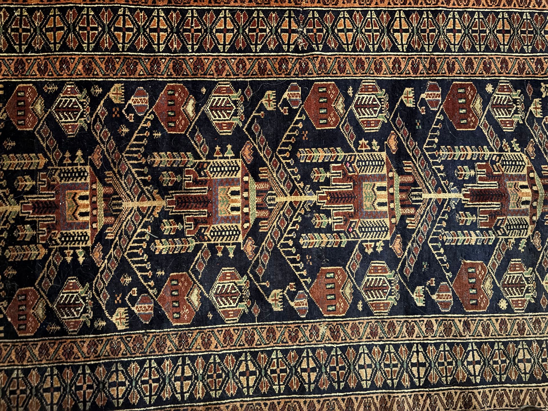 A close up of a rug with a pattern on it.