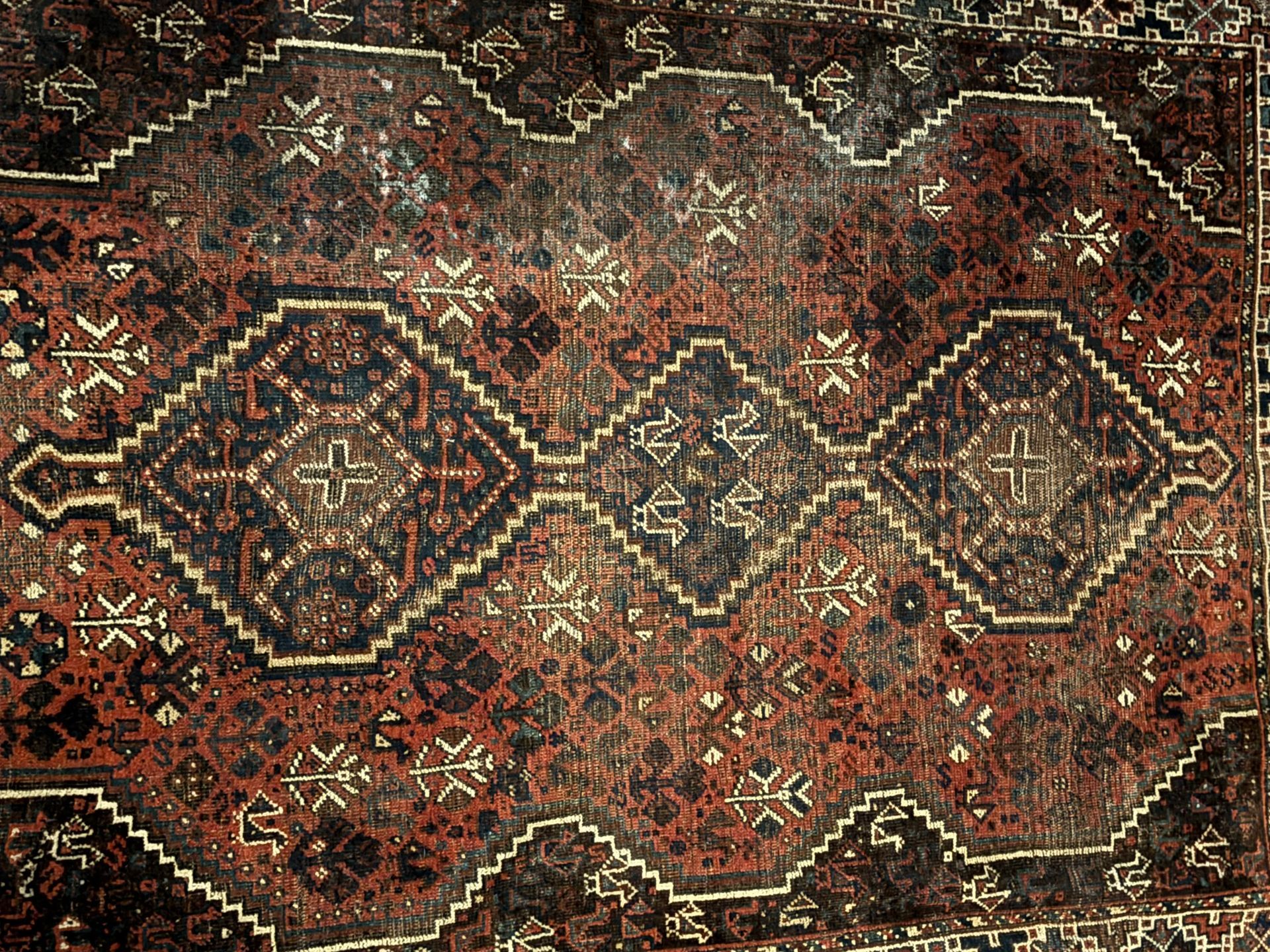 A close up of a rug with a pattern on it.