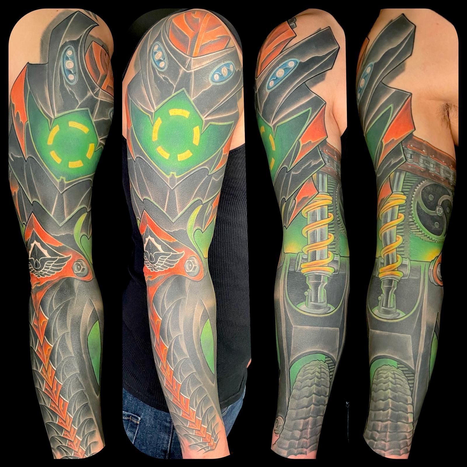 A man has a tattoo of a robot on his arm