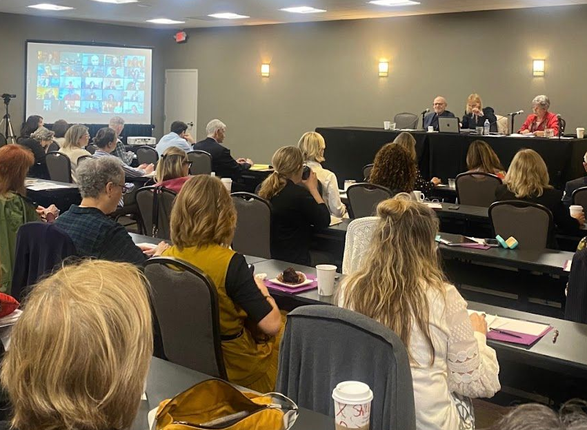 Caroline introducing a guest speaker at an IPI hybrid conference. 