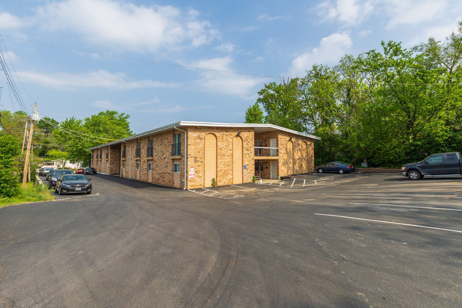 Cunningham brick building with large parking lot.