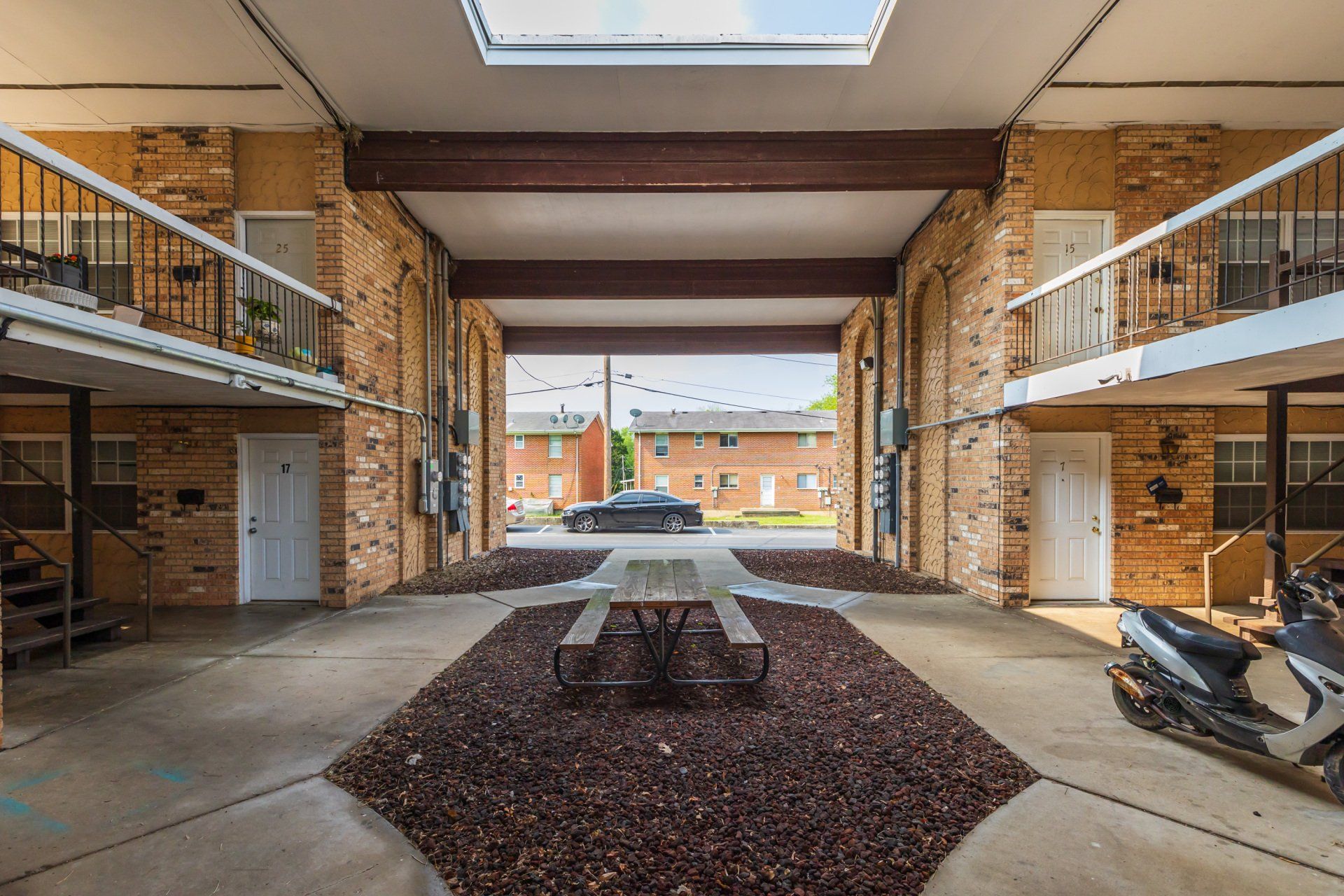 Community outdoor space with picnic bench.