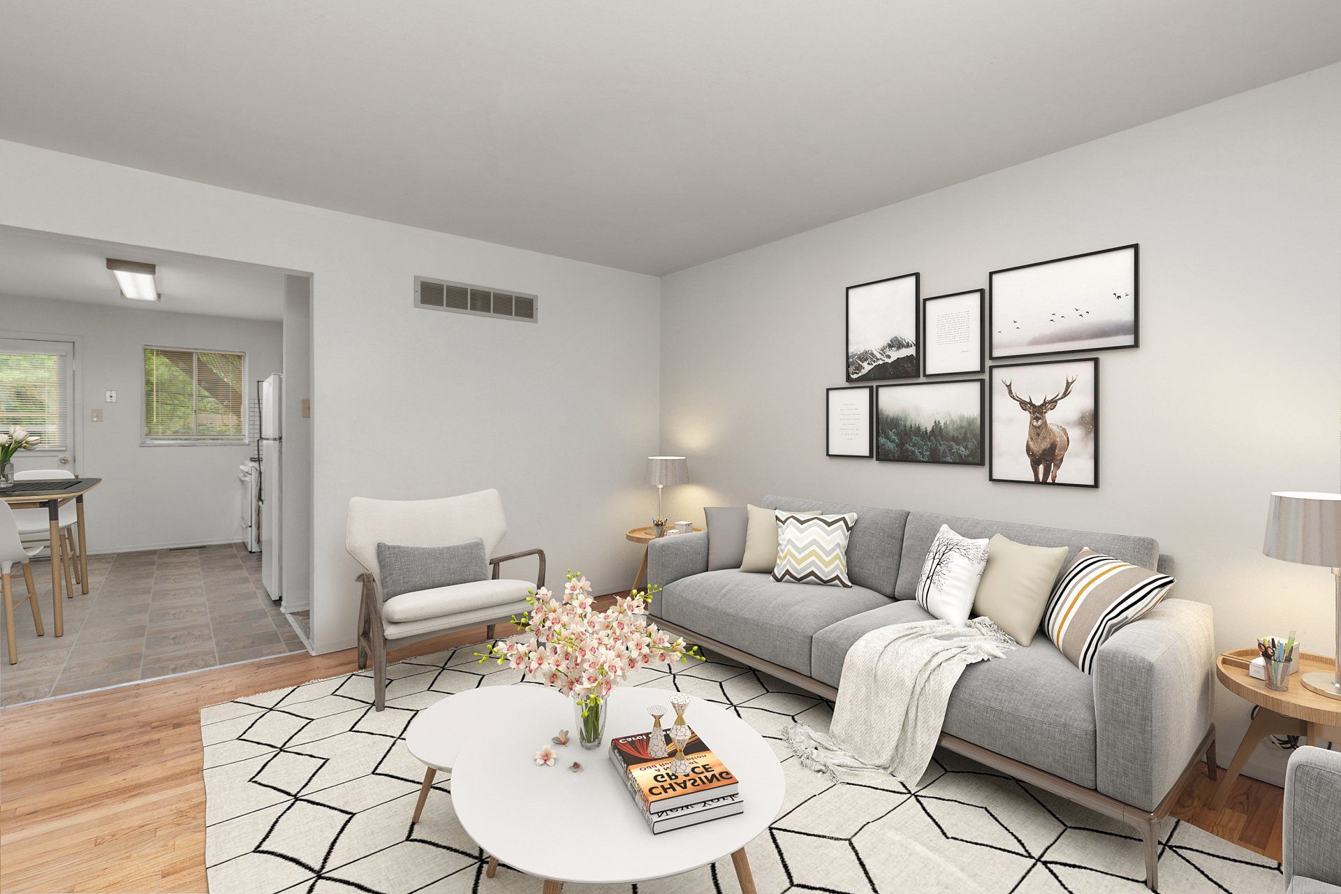 Leslie Apartments living room with couch, rug, and coffee table - furniture for example purposes only.