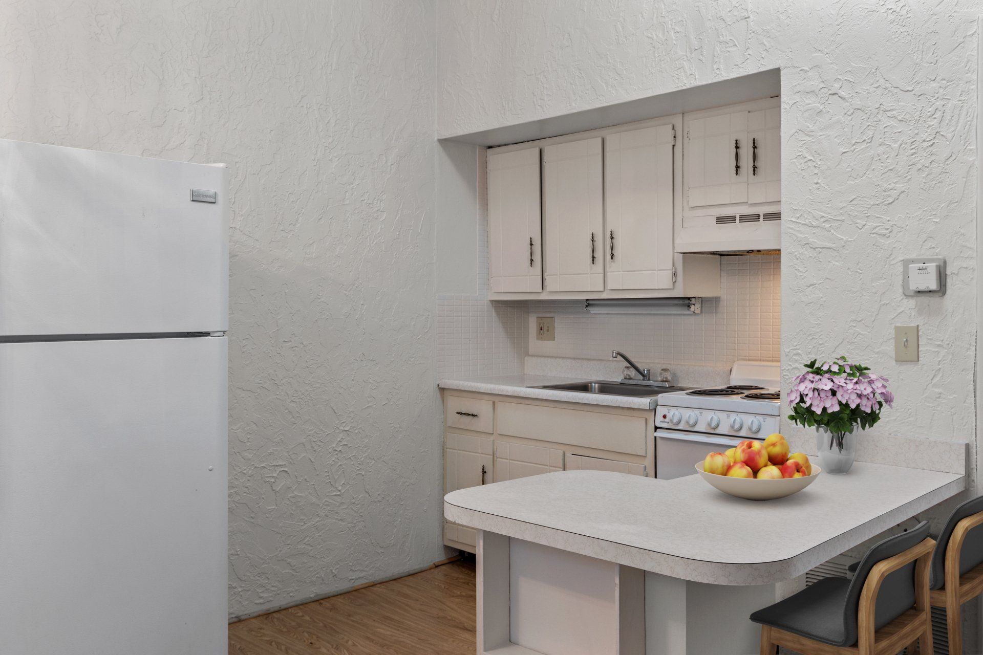 View of kitchen and breakfast bar.
