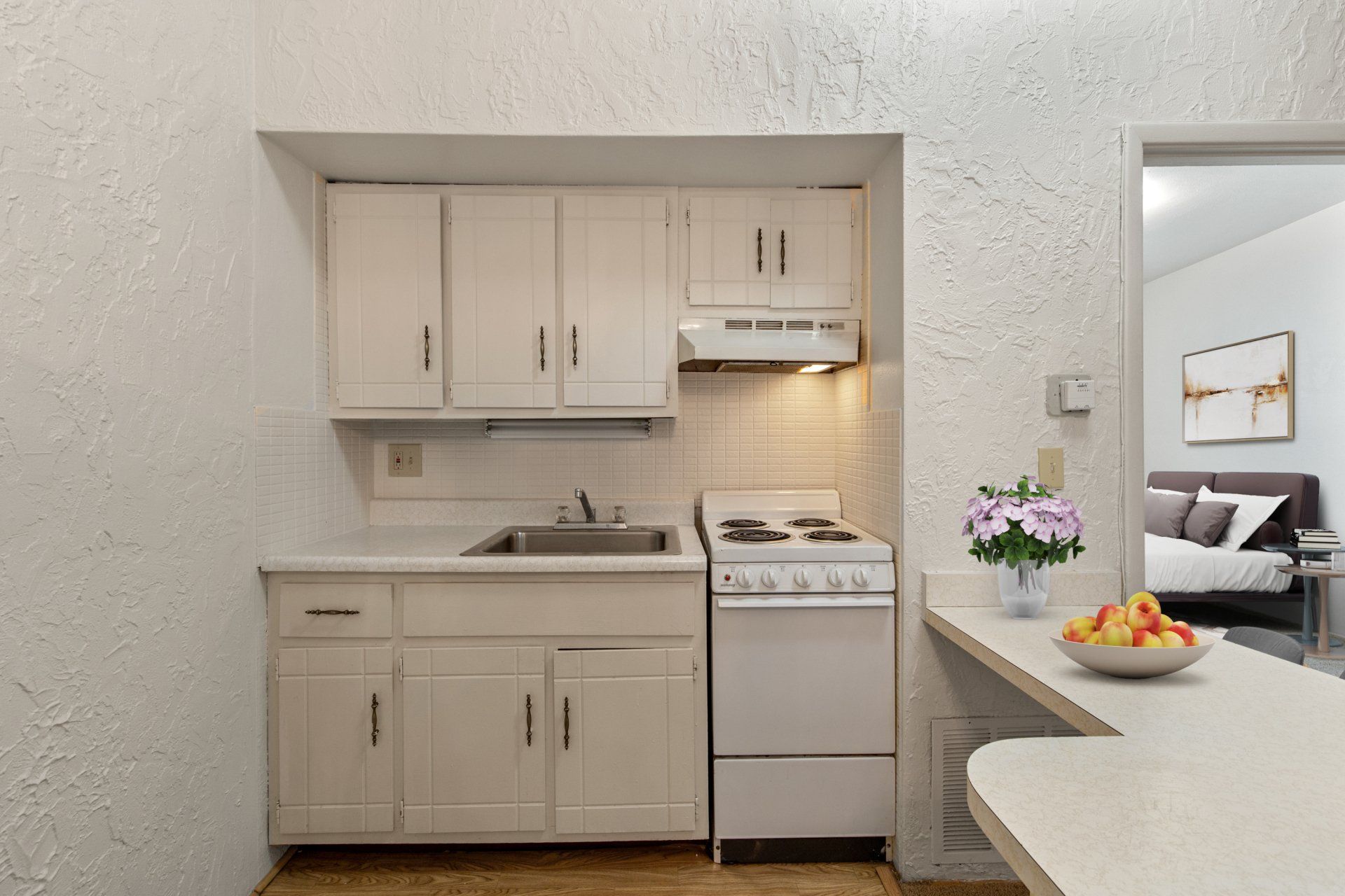Updated kitchen with light cabinets.