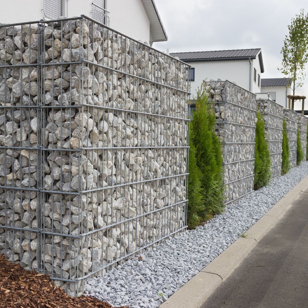 Gabion Wall Filled With Gray Rocks — PROFENCE AND RETAINING in Beecher, QLD