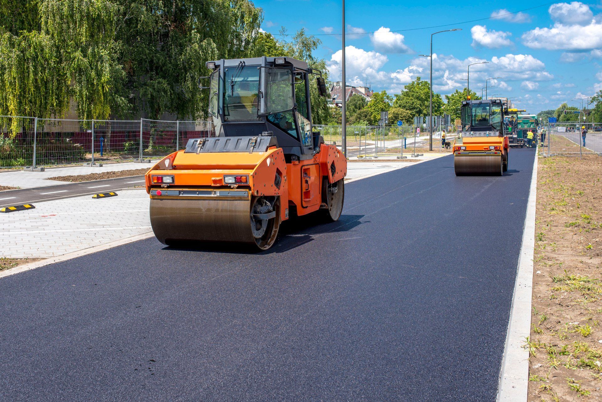 A couple of rollers are driving down a road.