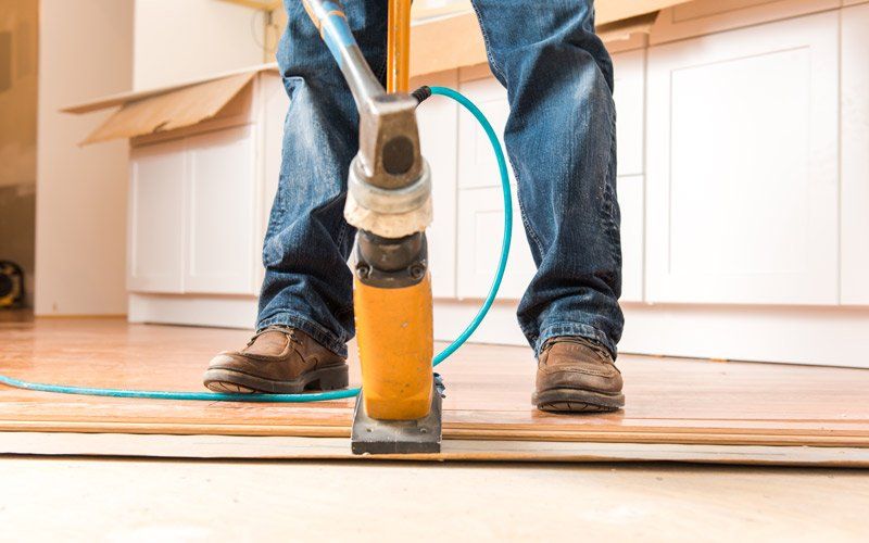 installing wood flooring with tools