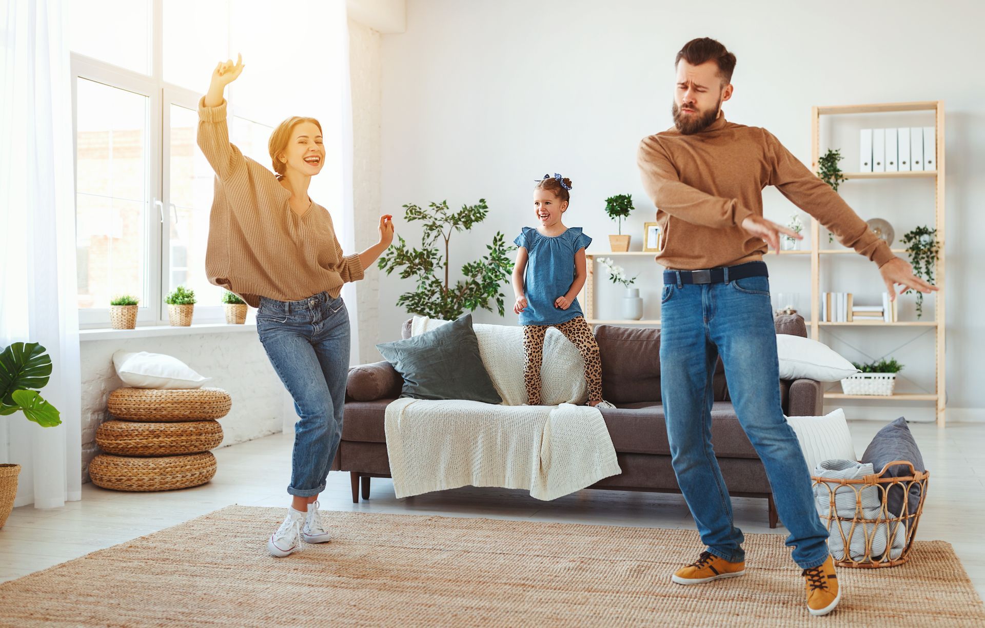 Family dancing in living room