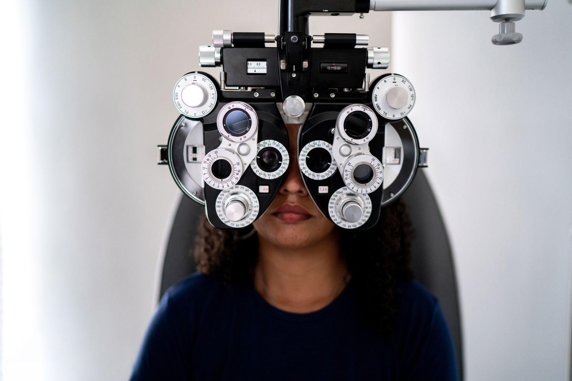 Woman Doing an Eye Exam — West Plains, MO — Vision Xpress