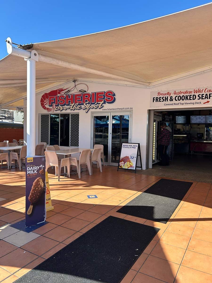 Fresh Seafood Restaurant With Tables And Chairs In Front Of It — Mooloolaba Fisheries On The Spit In Mooloolaba, QLD
