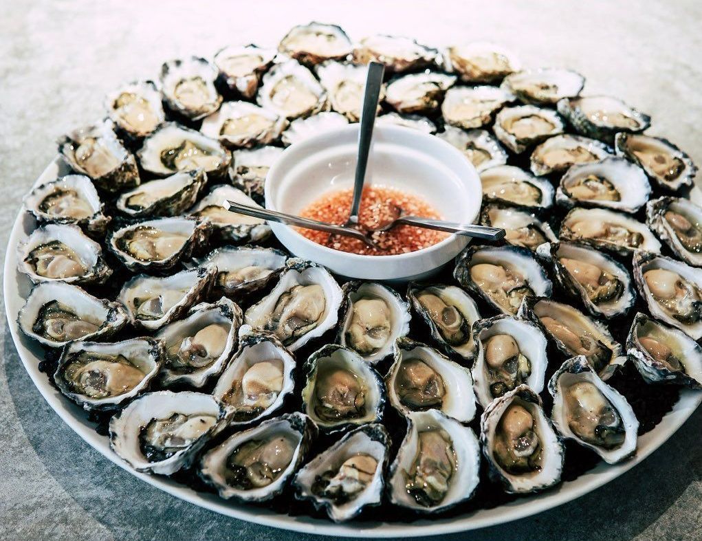 Plate Of Oysters With A Small Bowl Of Dipping Sauce — Mooloolaba Fisheries On The Spit In Mooloolaba, QLD