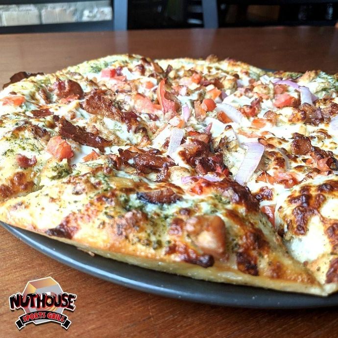 A man wearing a number 84 jersey stands in front of a crowd