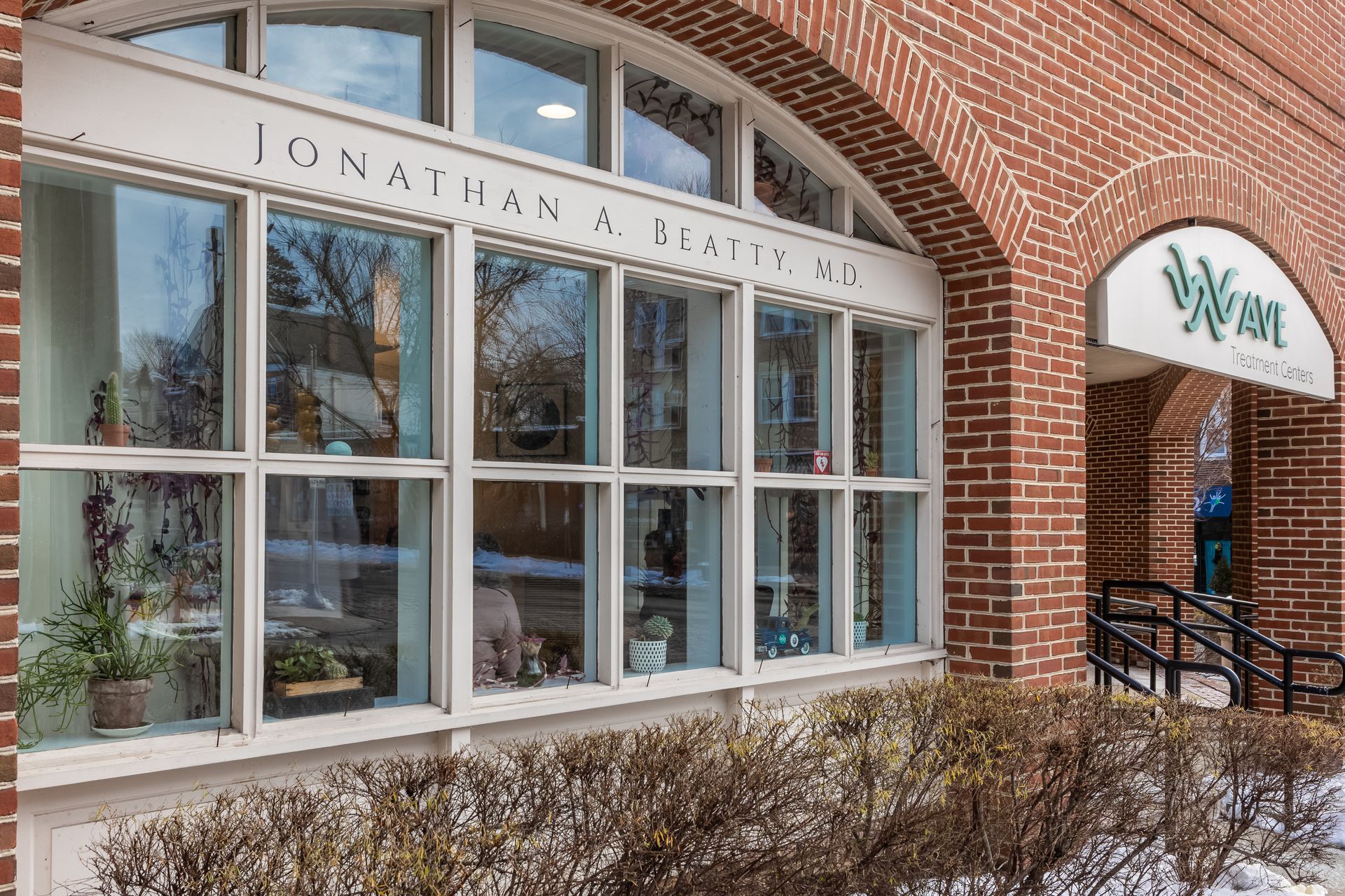A brick building with a lot of windows and a sign that says ' jonathan x smith ' on it.