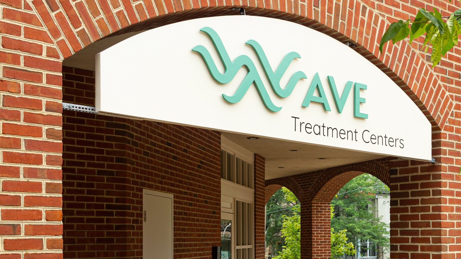 A brick building with a sign that says wave treatment centers