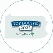 The logo for top doctor 2022 is a circle with a map of pennsylvania.