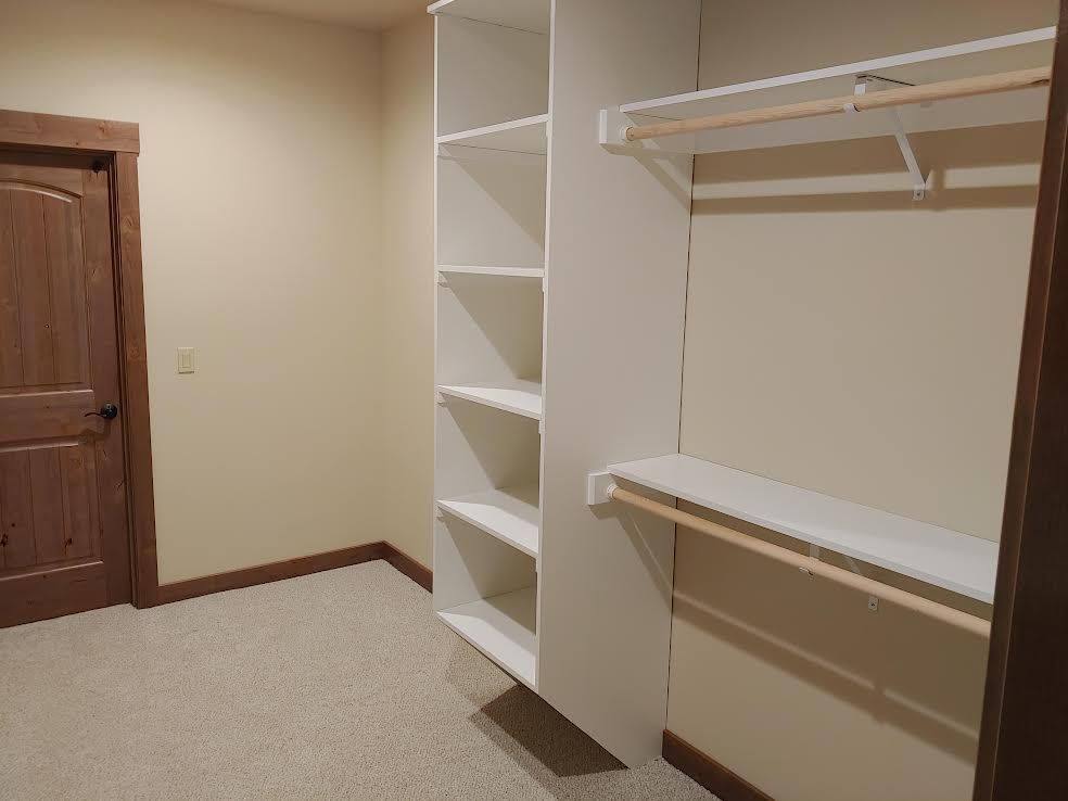 Close-up of brick pavers on a driveway, with a low angle view. Sun reflects on some bricks.