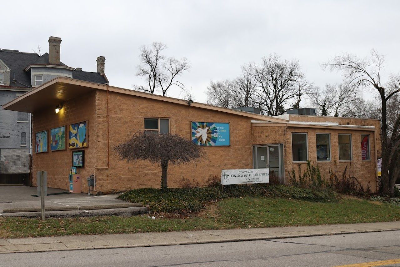 A brick building with a tree in front of it