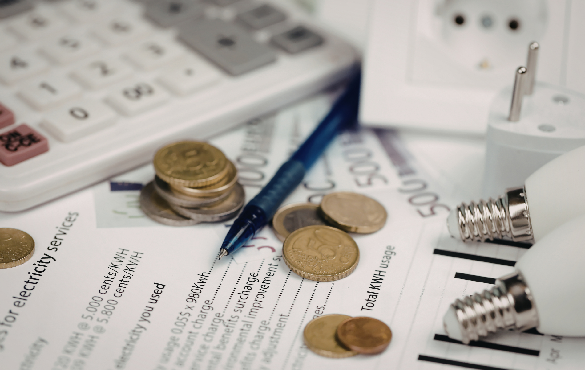 Yellow vinyl being fed into a wide-format cutting machine, person's hands visible.
