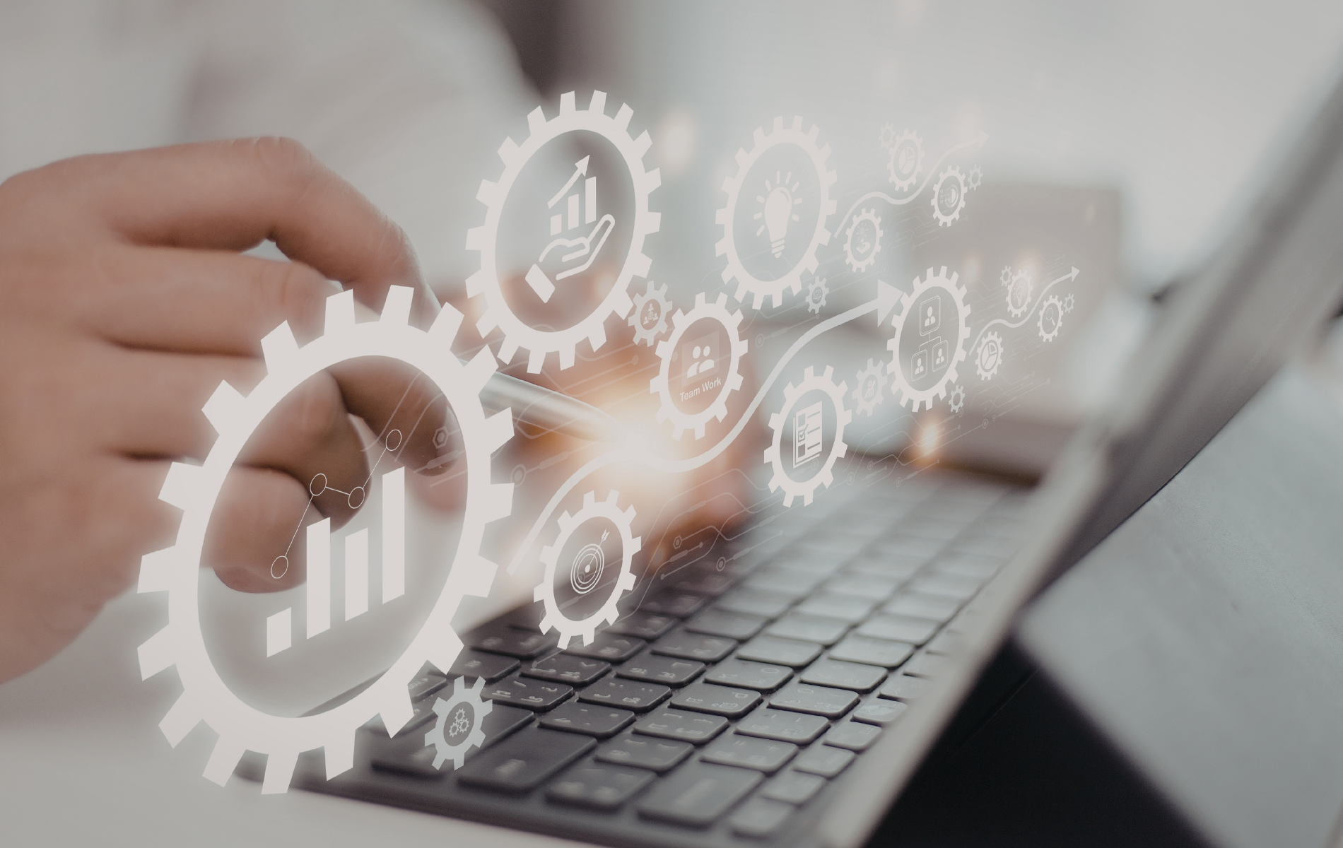 Yellow vinyl being fed into a wide-format cutting machine, person's hands visible.